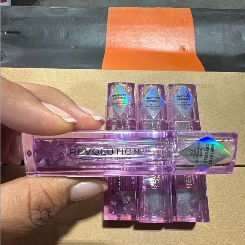 Revolution Purple Amethyst Crystal Aura Lip Oil. Roller ball. Natural.